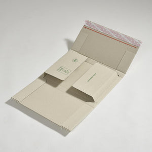 Nachhaltige Buchverpackung "VarioFix Green" aus Graspapier offen mit Selbstklebestreifen